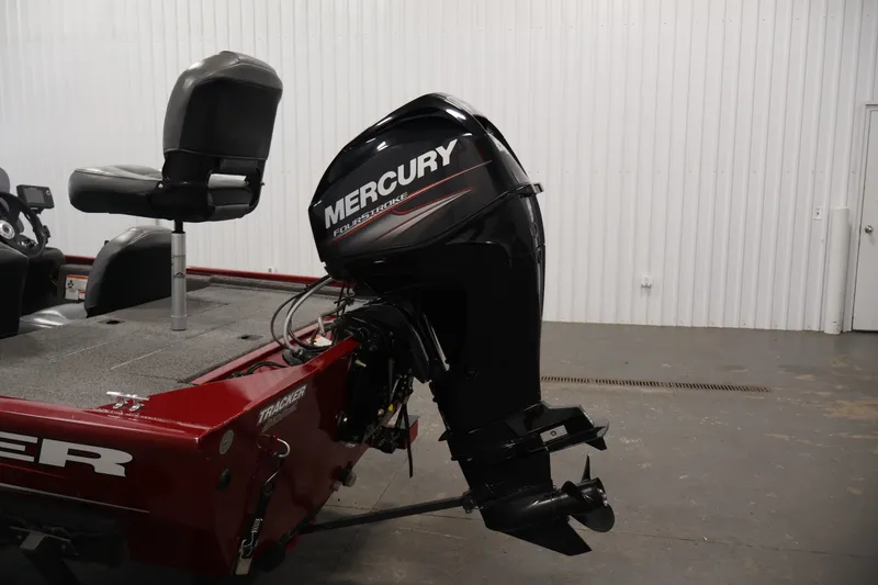 Slide: The Image of 2019 Tracker Pro 170 boat with Mercury FourStroke outboard motor in a garage setting. - 30