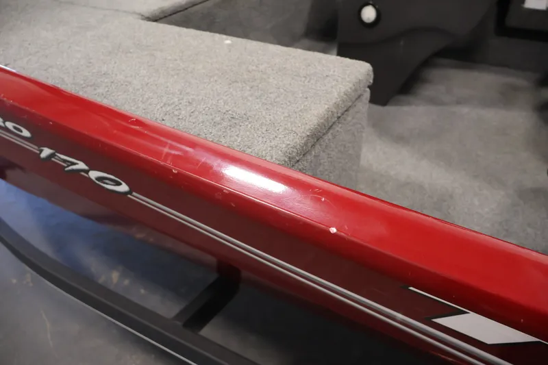 Slide: The Image of 2019 Tracker Pro 170 boat interior with red trim and gray seating. - 36