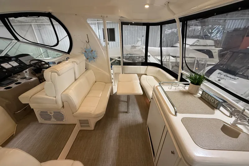 Slide: The Image of Luxurious interior of 2004 Cruisers Yachts 405 Express Motoryacht with plush seating and modern amenities. - 10