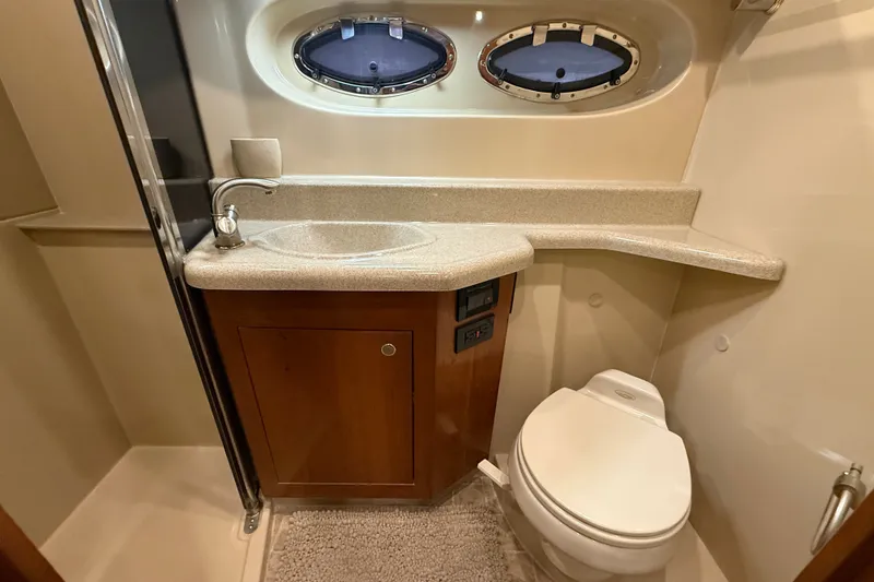 Slide: The Image of Luxurious bathroom in 2004 Cruisers Yachts 405 Express Motoryacht with sink and toilet. - 82