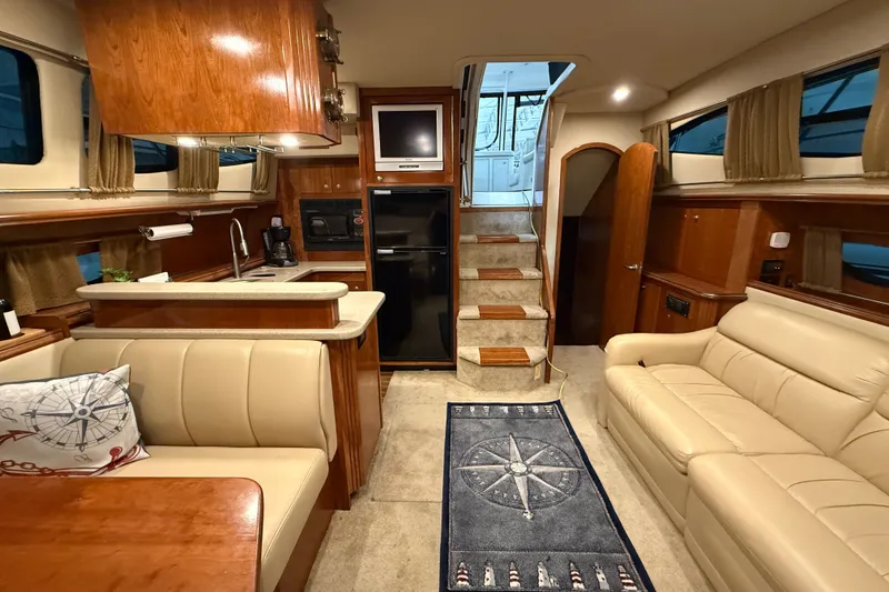 Slide: The Image of Luxurious interior of 2004 Cruisers Yachts 405 Express Motoryacht with elegant seating and kitchenette. - 69