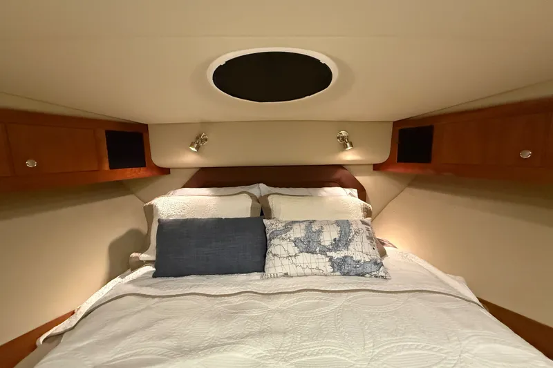 Slide: The Image of Luxurious bedroom interior of 2004 Cruisers Yachts 405 Express Motoryacht with cozy bedding. - 58