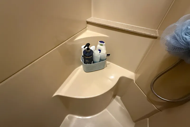 Slide: The Image of Shower area in 2004 Cruisers Yachts 405 Express Motoryacht with toiletries and loofah. - 62