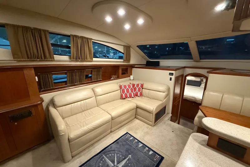 Slide: The Image of Luxurious interior of 2004 Cruisers Yachts 405 Express Motoryacht with beige leather seating. - 45