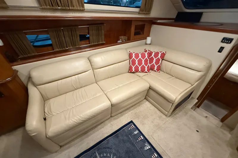 Slide: The Image of Luxurious beige leather sofa in 2004 Cruisers Yachts 405 Express Motoryacht interior. - 47