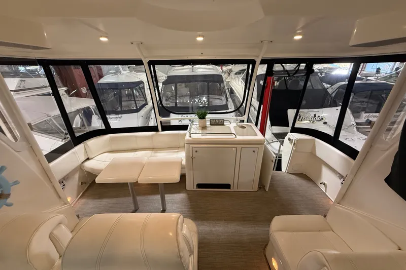 Slide: The Image of Luxurious interior of 2004 Cruisers Yachts 405 Express Motoryacht with seating and kitchenette. - 36