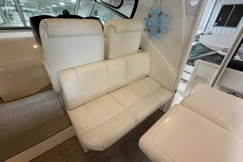Slide: The Image of White leather seating on 2004 Cruisers Yachts 405 Express Motoryacht interior. - 19