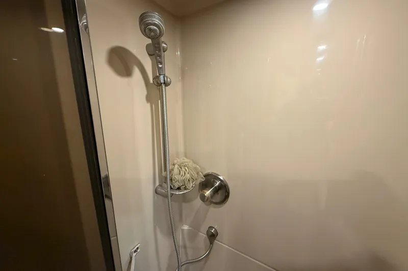 Slide: The Image of Shower area in 2004 Cruisers Yachts 405 Express Motoryacht, featuring handheld showerhead. - 87