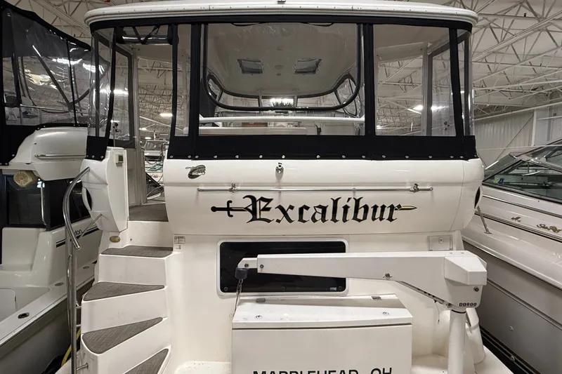Slide: The Image of 2004 Cruisers Yachts 405 Express Motoryacht "Excalibur" docked indoors, rear view. - 8