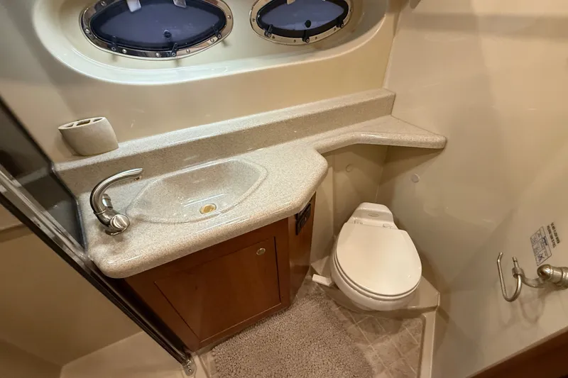 Slide: The Image of Luxurious bathroom in 2004 Cruisers Yachts 405 Express Motoryacht with sink and toilet. - 81