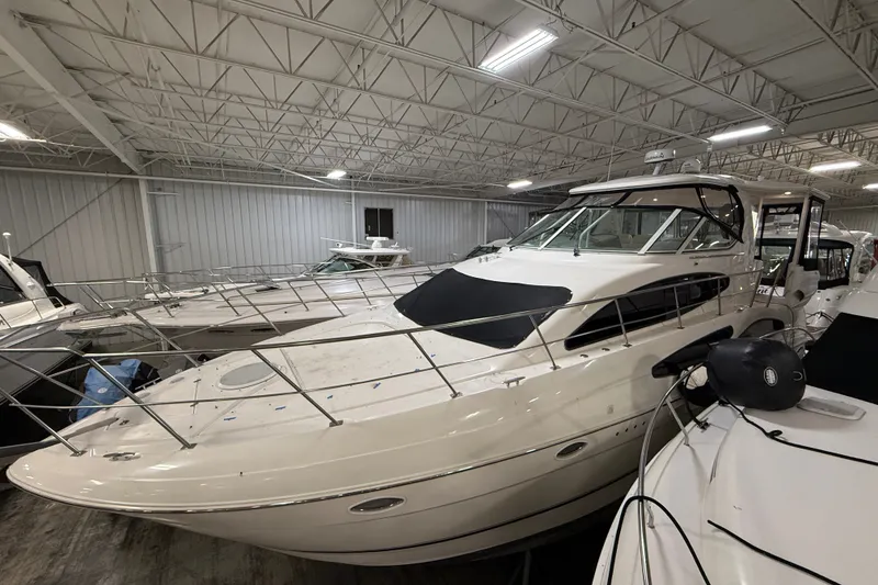 Slide: The Image of 2004 Cruisers Yachts 405 Express Motoryacht in indoor storage facility. - 3