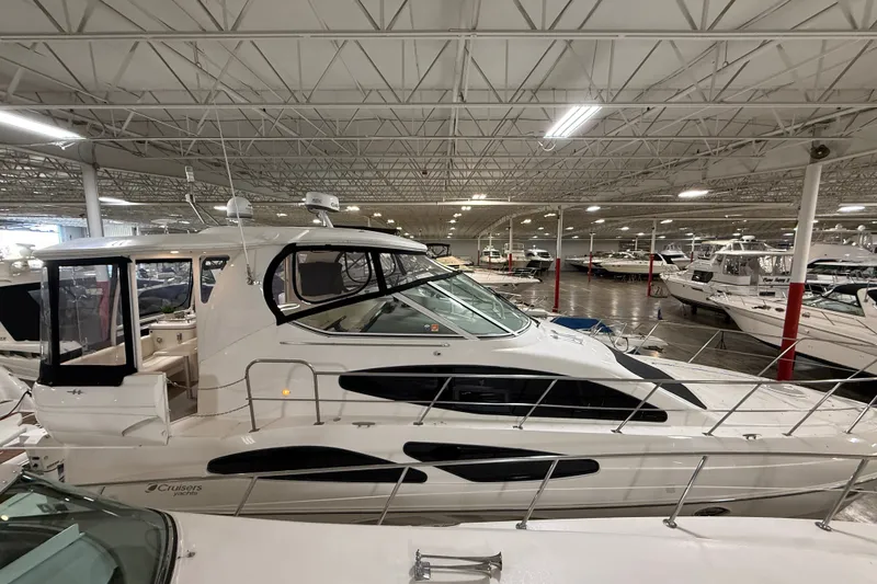 Slide: The Image of 2004 Cruisers Yachts 405 Express Motoryacht in indoor showroom, side view. - 5