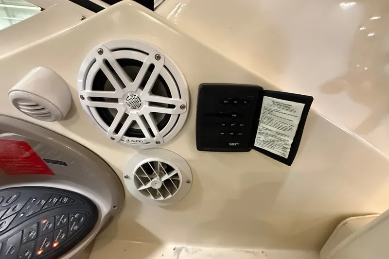 Slide: The Image of 2004 Cruisers Yachts 405 Express Motoryacht dashboard with JL Audio speaker and control panel. - 33