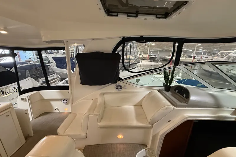 Slide: The Image of Interior of 2004 Cruisers Yachts 405 Express Motoryacht with plush seating and large windows. - 34