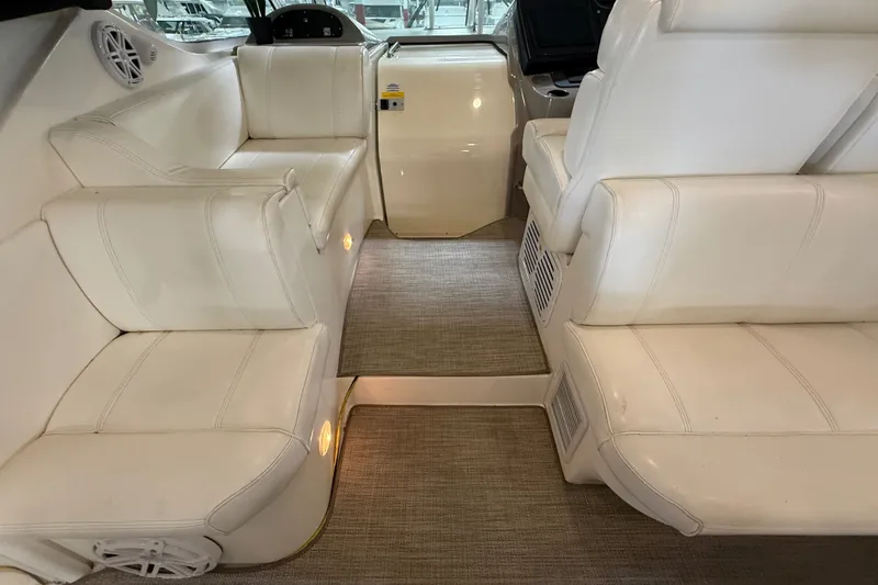 Slide: The Image of Interior of 2004 Cruisers Yachts 405 Express Motoryacht with white leather seating. - 22