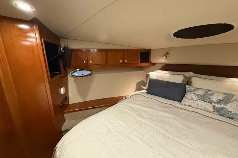 Slide: The Image of Luxurious bedroom interior of 2004 Cruisers Yachts 405 Express Motoryacht with cozy bedding. - 56