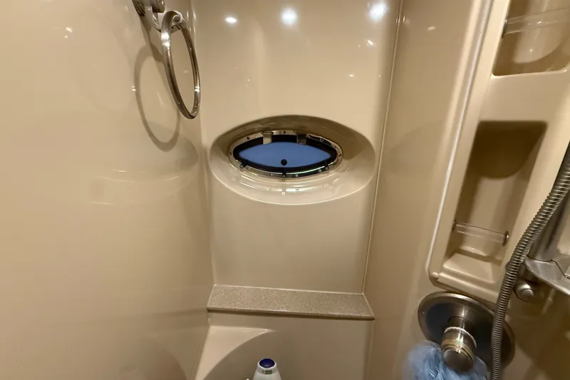 Slide: The Image of Bathroom interior of 2004 Cruisers Yachts 405 Express Motoryacht with porthole and shower fixtures. - 61