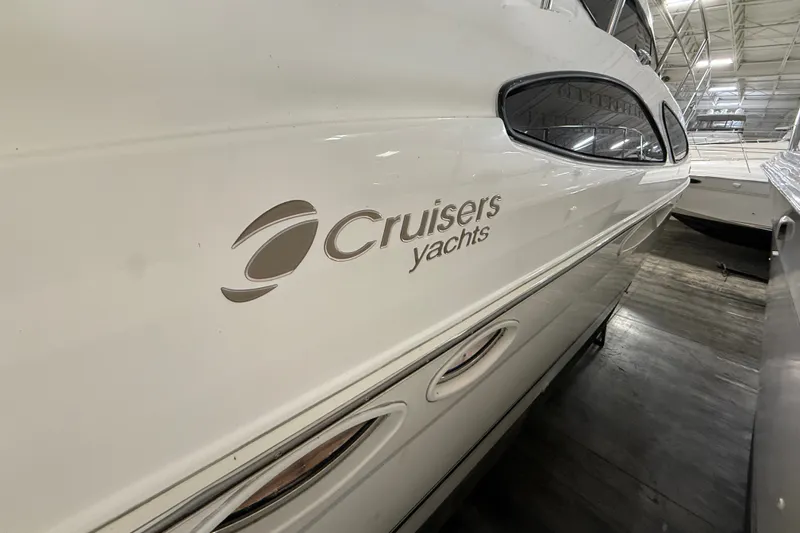 Slide: The Image of 2004 Cruisers Yachts 405 Express Motoryacht in storage, showcasing sleek design and branding. - 6