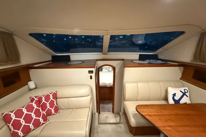 Slide: The Image of Luxurious interior of 2004 Cruisers Yachts 405 Express Motoryacht with plush seating and nautical decor. - 48