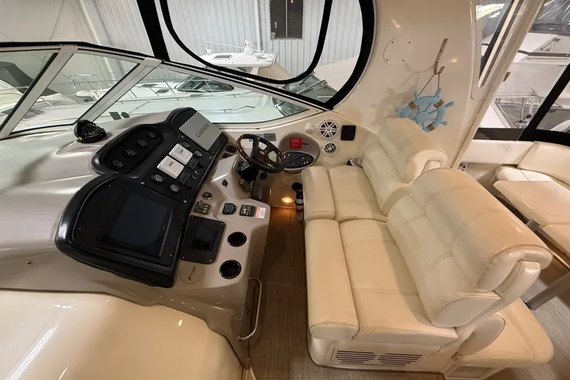 Slide: The Image of Luxurious helm of 2004 Cruisers Yachts 405 Express Motoryacht with plush seating and advanced controls. - 25