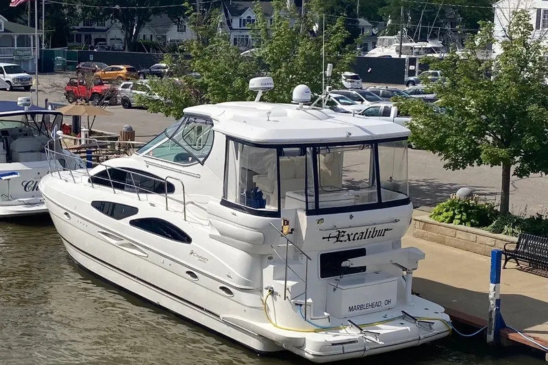 Slide: The Image of 2004 Cruisers Yachts 405 Express Motoryacht docked at marina, sunny day. - 1