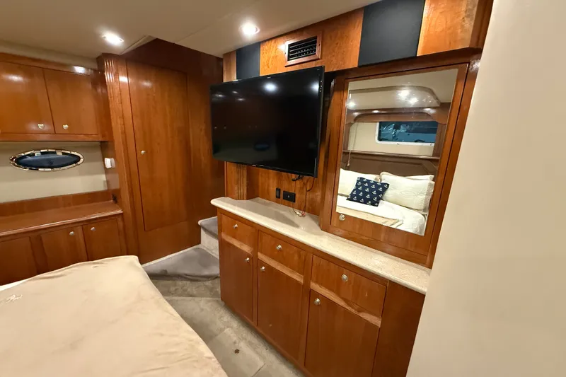 Slide: The Image of Luxurious 2004 Cruisers Yachts 405 Express Motoryacht interior with wood cabinetry and modern amenities. - 76