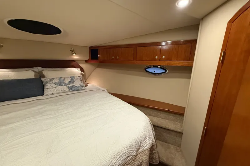 Slide: The Image of Luxurious bedroom interior of 2004 Cruisers Yachts 405 Express Motoryacht with cozy bedding. - 55