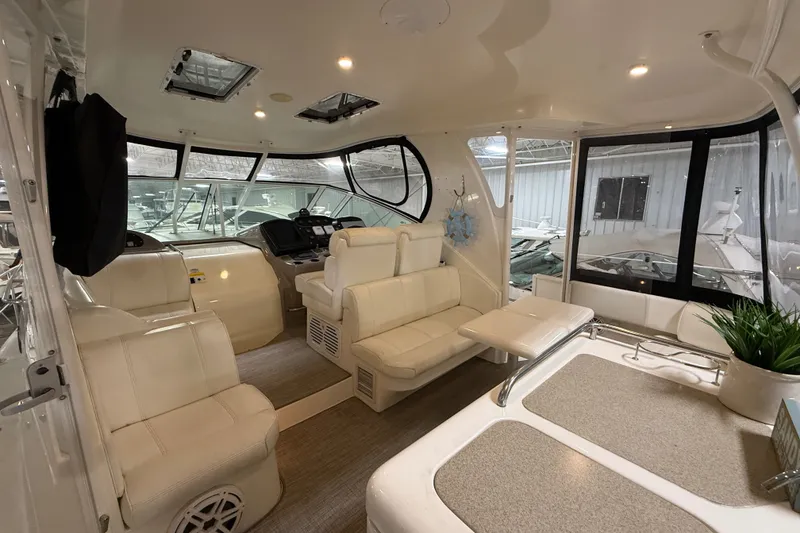 Slide: The Image of Luxurious interior of 2004 Cruisers Yachts 405 Express Motoryacht with plush seating and helm. - 9