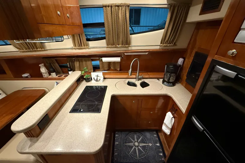 Slide: The Image of Luxurious kitchen interior of 2004 Cruisers Yachts 405 Express Motoryacht with modern amenities. - 40