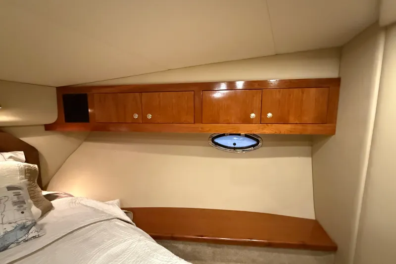 Slide: The Image of Luxurious cabin interior of 2004 Cruisers Yachts 405 Express Motoryacht with wooden cabinetry. - 57