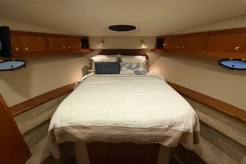 Slide: The Image of Luxurious bedroom interior of 2004 Cruisers Yachts 405 Express Motoryacht with cozy bedding. - 54
