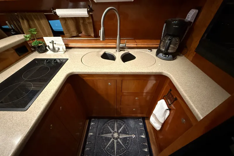 Slide: The Image of Luxurious 2004 Cruisers Yachts 405 Express Motoryacht kitchen with modern amenities. - 41