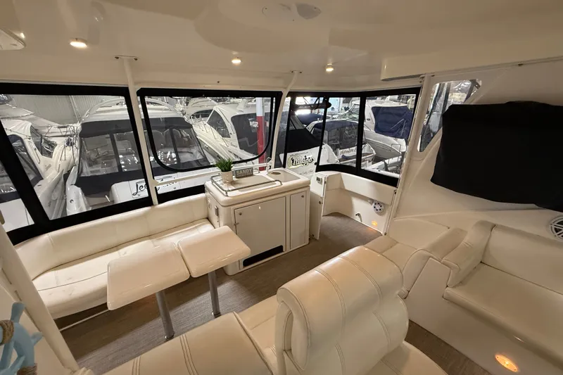 Slide: The Image of Luxurious interior of 2004 Cruisers Yachts 405 Express Motoryacht with plush seating and large windows. - 35
