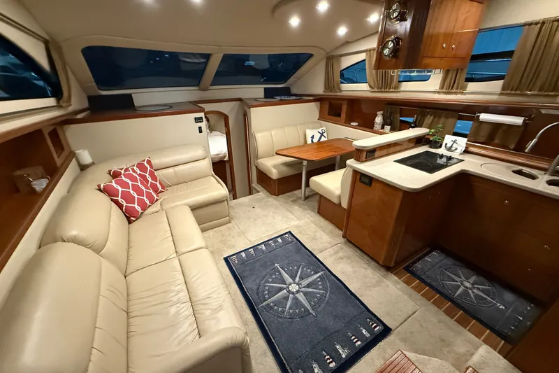 Slide: The Image of Luxurious interior of 2004 Cruisers Yachts 405 Express Motoryacht with elegant seating and kitchen area. - 38