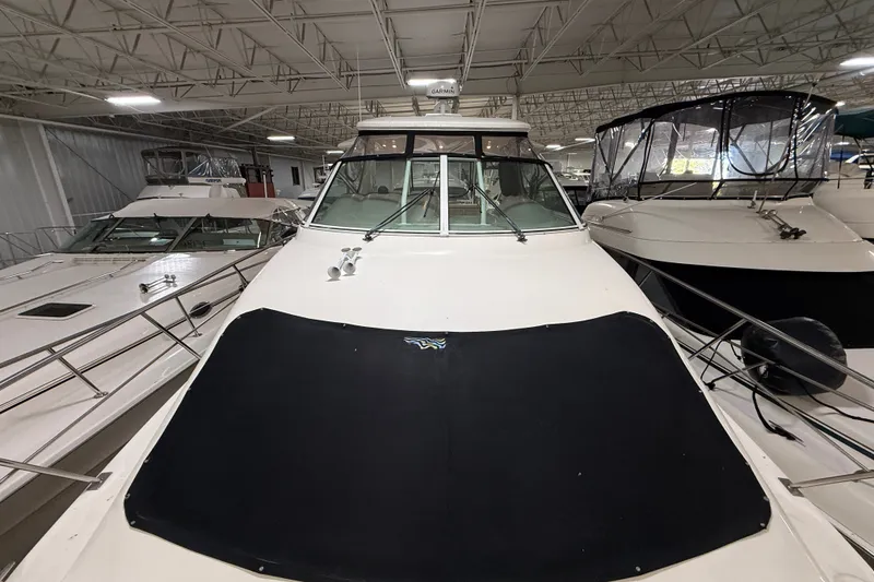 Slide: The Image of 2004 Cruisers Yachts 405 Express Motoryacht in indoor storage facility. - 4