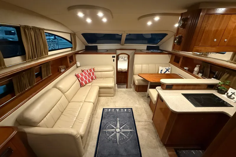 Slide: The Image of Luxurious 2004 Cruisers Yachts 405 Express Motoryacht interior with elegant seating and modern kitchen. - 37