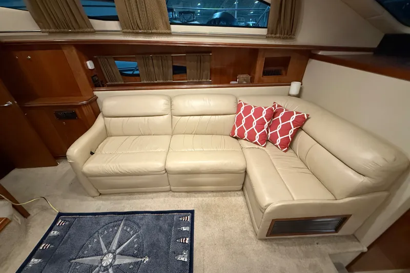 Slide: The Image of Luxurious interior of 2004 Cruisers Yachts 405 Express Motoryacht with beige leather sofa. - 46