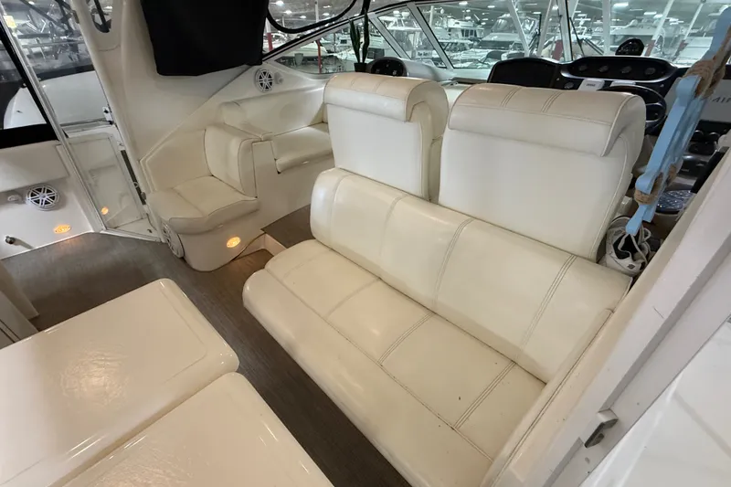 Slide: The Image of 2004 Cruisers Yachts 405 Express Motoryacht interior with white leather seating and modern design. - 18
