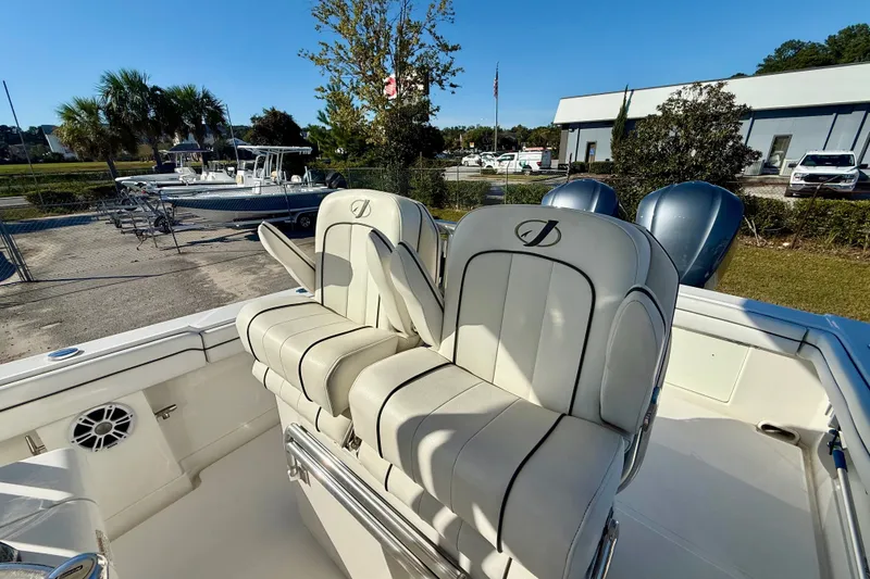 Slide: The Image of 2018 Jupiter 30 HFS boat interior with dual seats and outdoor setting. - 4