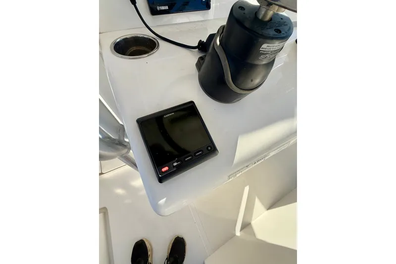 Slide: The Image of 2018 Jupiter 30 HFS boat dashboard with Garmin display and Yamaha controls. - 9