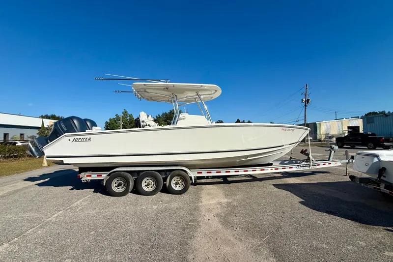 Slide: The Image of 2018 Jupiter 30 HFS boat on trailer under clear blue sky. - 1