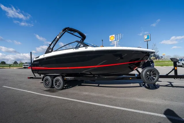 The Image of A 2026 Cobalt R4 boat on a trailer in a parking lot. - 0