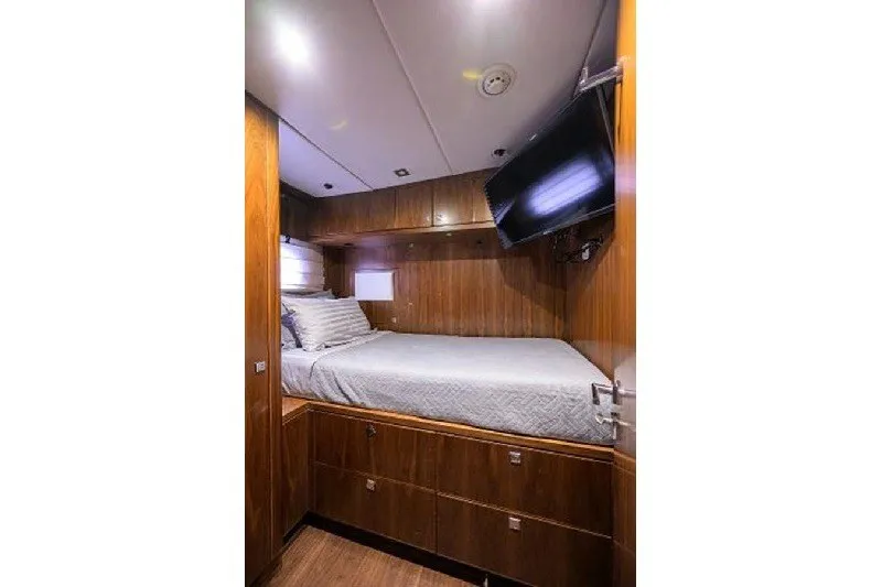 Slide: The Image of Luxurious cabin interior of 2018 Hargrave Raised Pilothouse yacht with wood paneling and TV. - 58