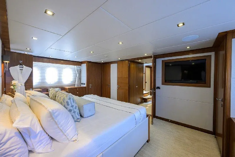 Slide: The Image of Luxurious bedroom interior on 2018 Hargrave Raised Pilothouse yacht, featuring elegant wood finishes. - 42