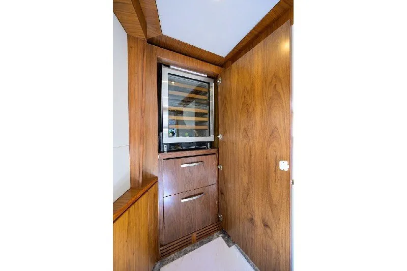 Slide: The Image of Luxurious wooden cabinetry with built-in wine cooler on 2018 Hargrave Raised Pilothouse yacht. - 36