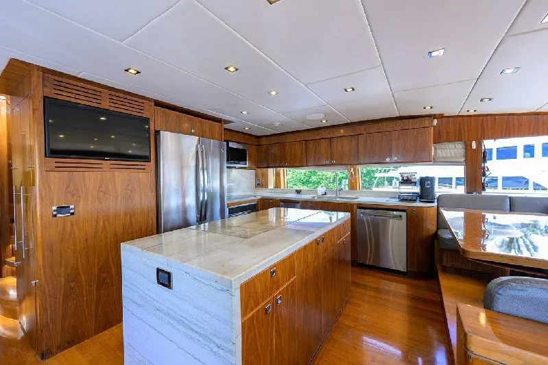 Slide: The Image of Luxurious 2018 Hargrave Raised Pilothouse yacht kitchen with modern appliances and elegant wood finishes. - 32