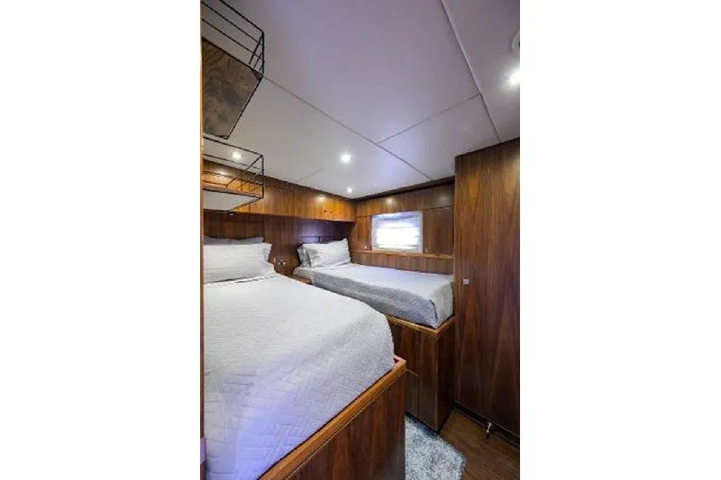 Slide: The Image of Luxurious twin cabin interior of 2018 Hargrave Raised Pilothouse yacht with wood paneling. - 61