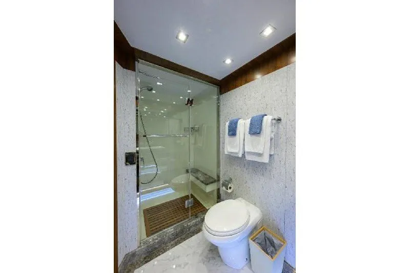 Slide: The Image of Luxurious bathroom in 2018 Hargrave Raised Pilothouse yacht with glass shower and modern fixtures. - 56