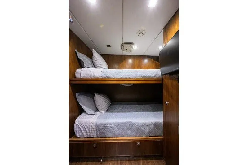 Slide: The Image of Bunk beds in 2018 Hargrave Raised Pilothouse yacht cabin with wood paneling. - 57
