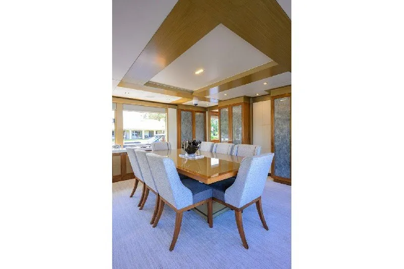 Slide: The Image of Luxurious dining area in 2018 Hargrave Raised Pilothouse yacht, featuring elegant furnishings. - 26